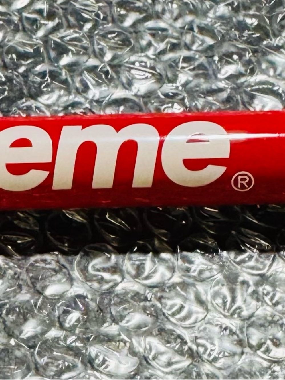 Supreme portable mini bicycle pump made by Lezyne.